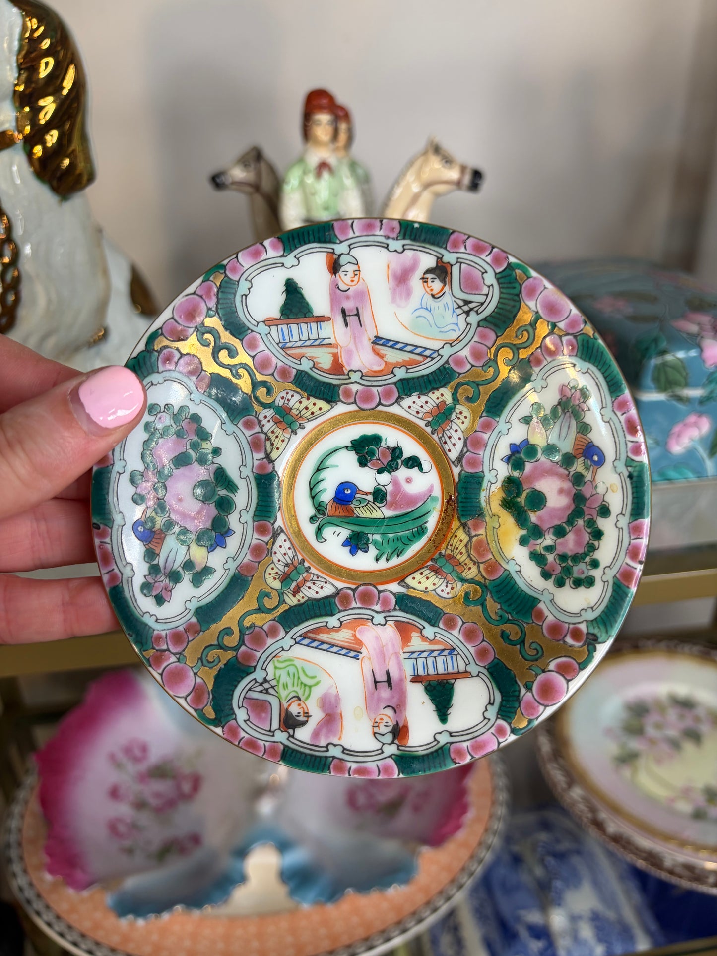 Famille Rose teacup and saucer handpainted featuring birds!