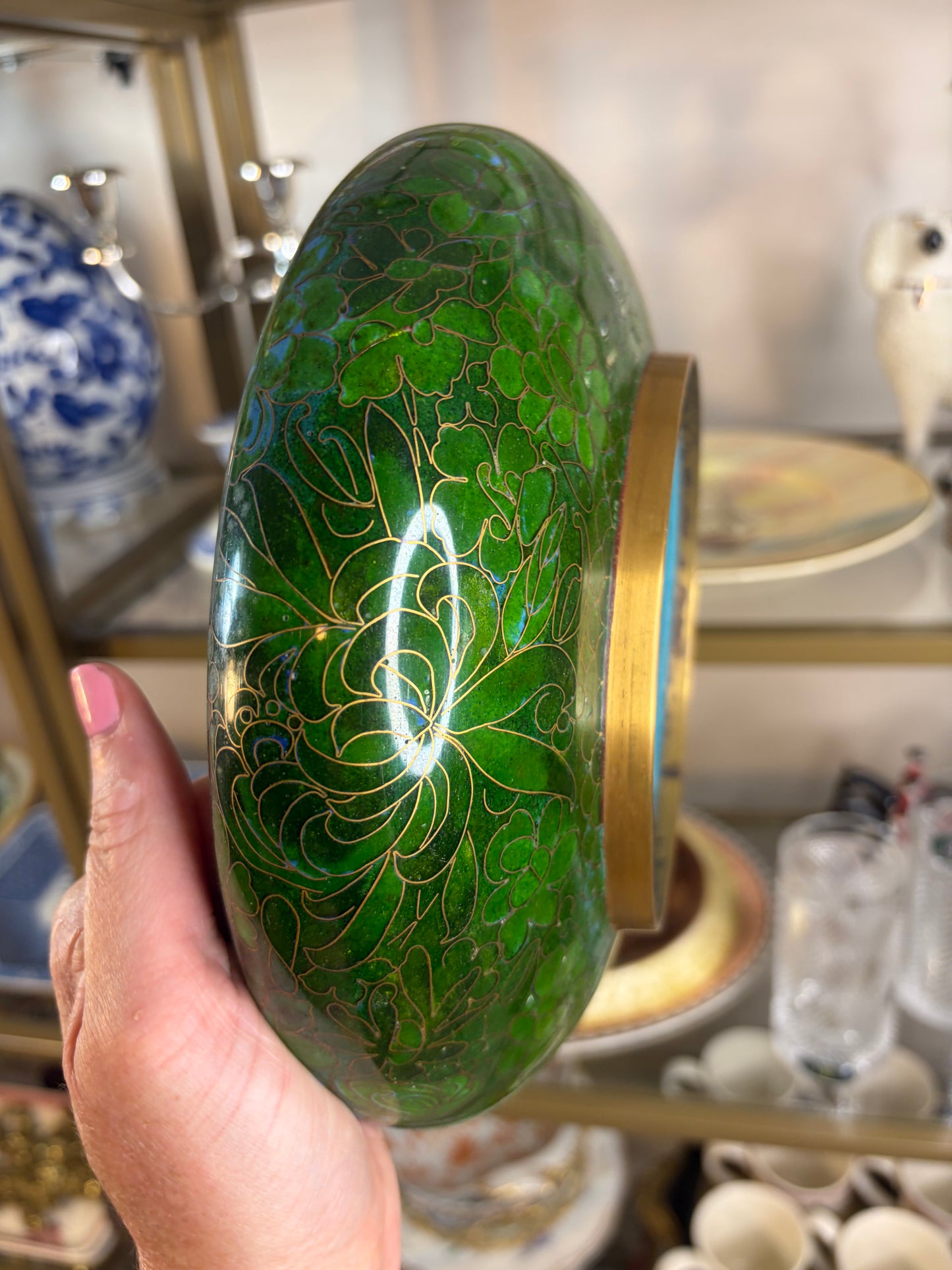 Gorgeous cloisonné green bowl featuring a bouquet and brass rim!