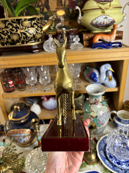 Brass carousel horse on wood!