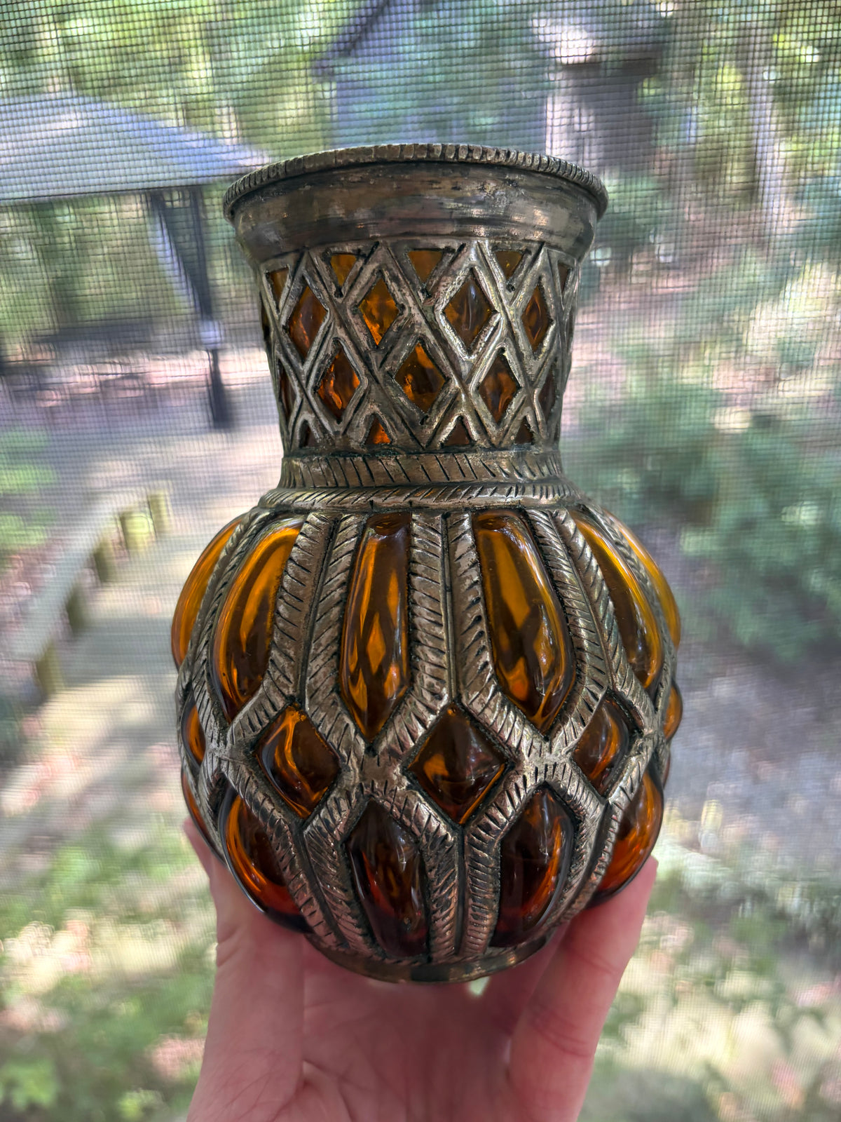 Lovely amber bubble glass vase encased in metal!