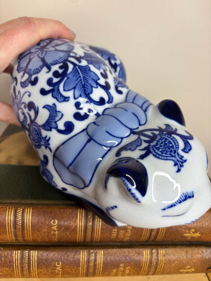 Chinoiserie blue and white resting cat with bow and floral designs!