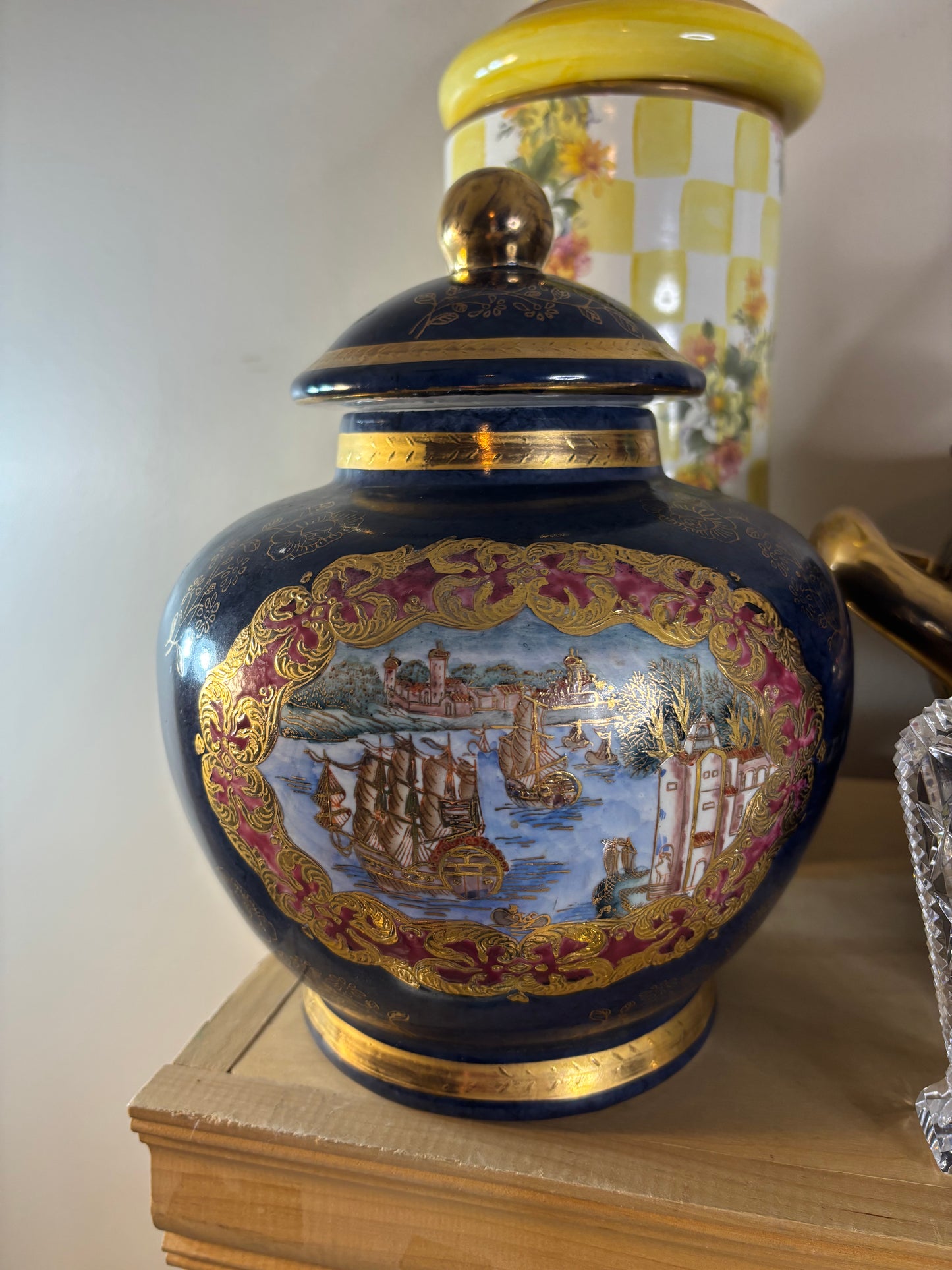 Cobalt lidded jar featuring ship scenes and gold details!