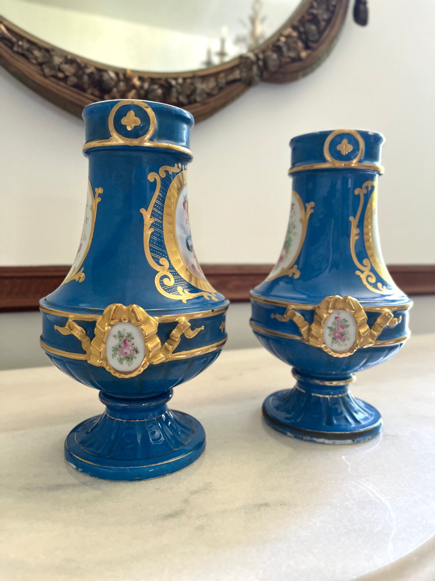 Elegant Pair of Antique 19th Century French Sèvres Style Porcelain Vases In Céleste Bleu With Hand-Painted Putti And Florals