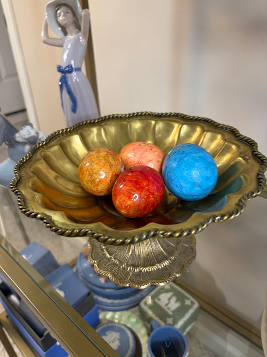 Beautiful brass scalloped pedestal bowl with rope design and intricate base! Includes four alabaster eggs!