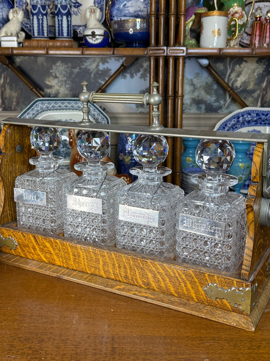 🔥🔥ON AUCTION🔥🔥 | c.1885 | George Betjemann & Sons Patent, London Victorian Oak Four-Bottle Tantalus with Hand-Cut Crystal Decanters & Sterling Silver Tags, 19.5” W × 13” H × 5.75” D, No. 21681