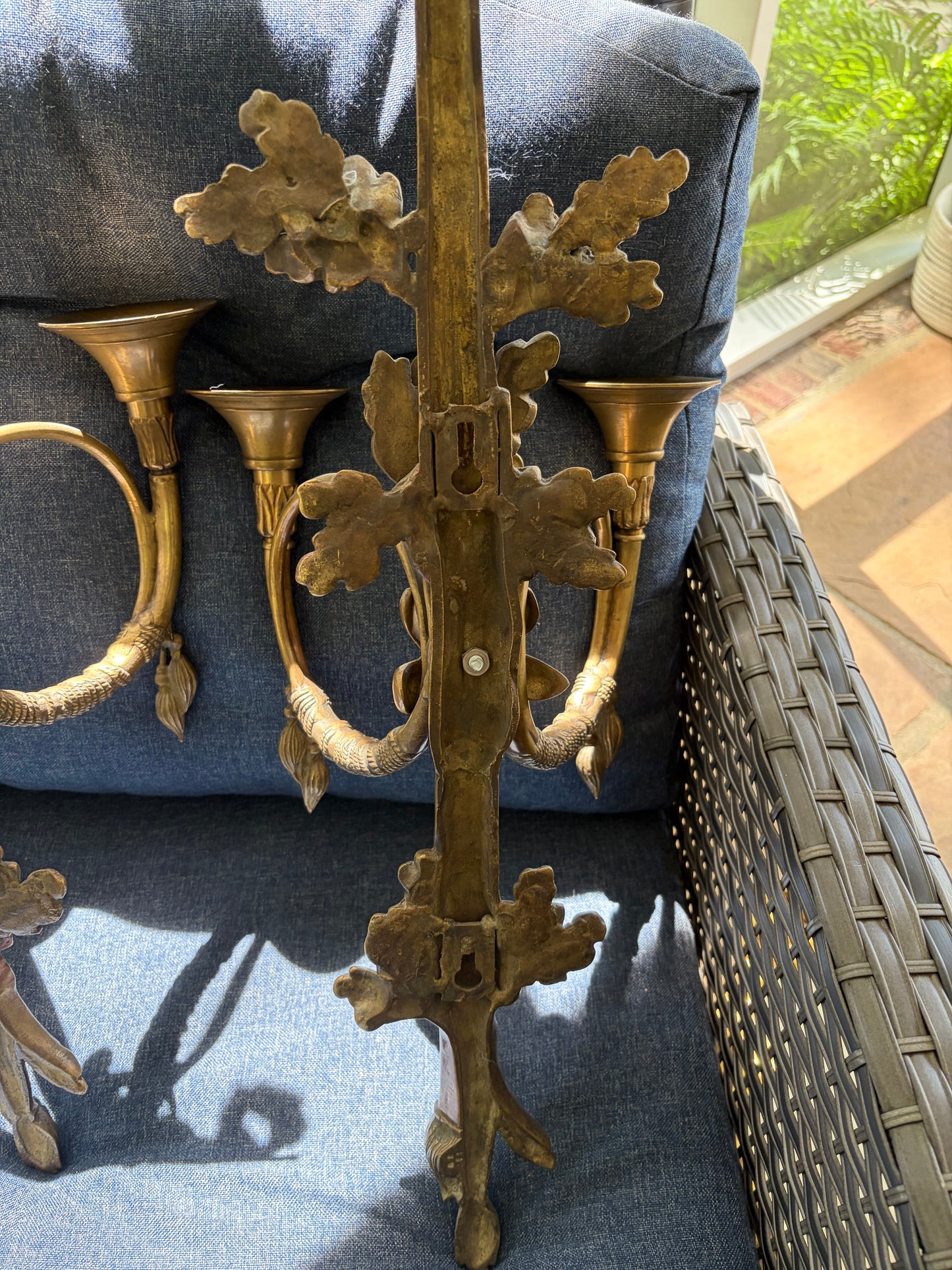 Stunning antique pair of French Louis XVI style brass wall sconces with bows, tassels, and horn motif designs!