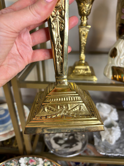 Beautiful brass candleholders pair featuring bows and ribbon designs!