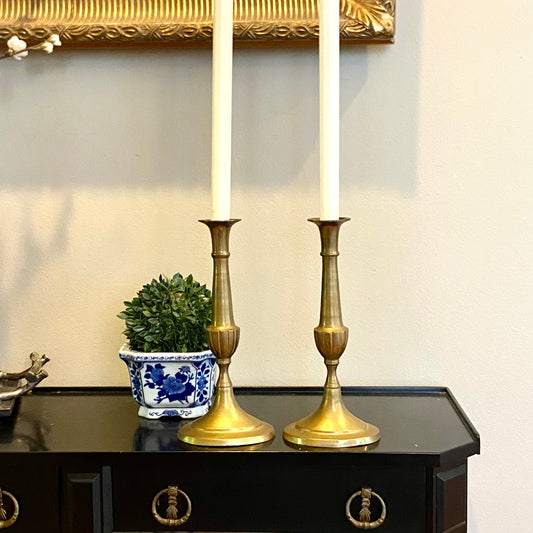 Statuesque vintage aged matte brass tall pillar candlestick holders