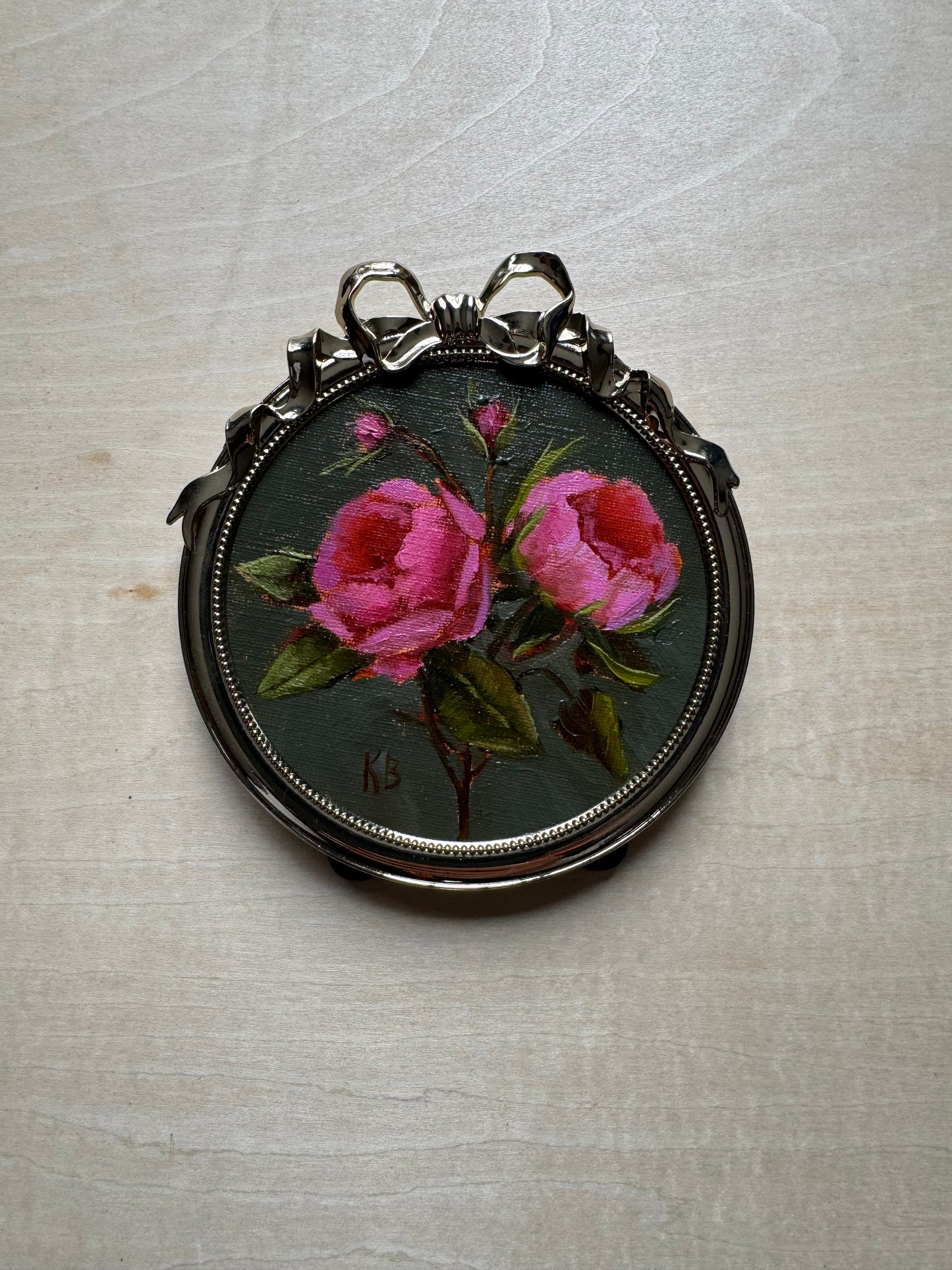 Pink roses sage green background