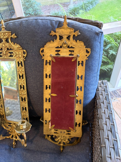 Stunning mirrored brass sconces pair with koi fish, ornate details, and tassel design!