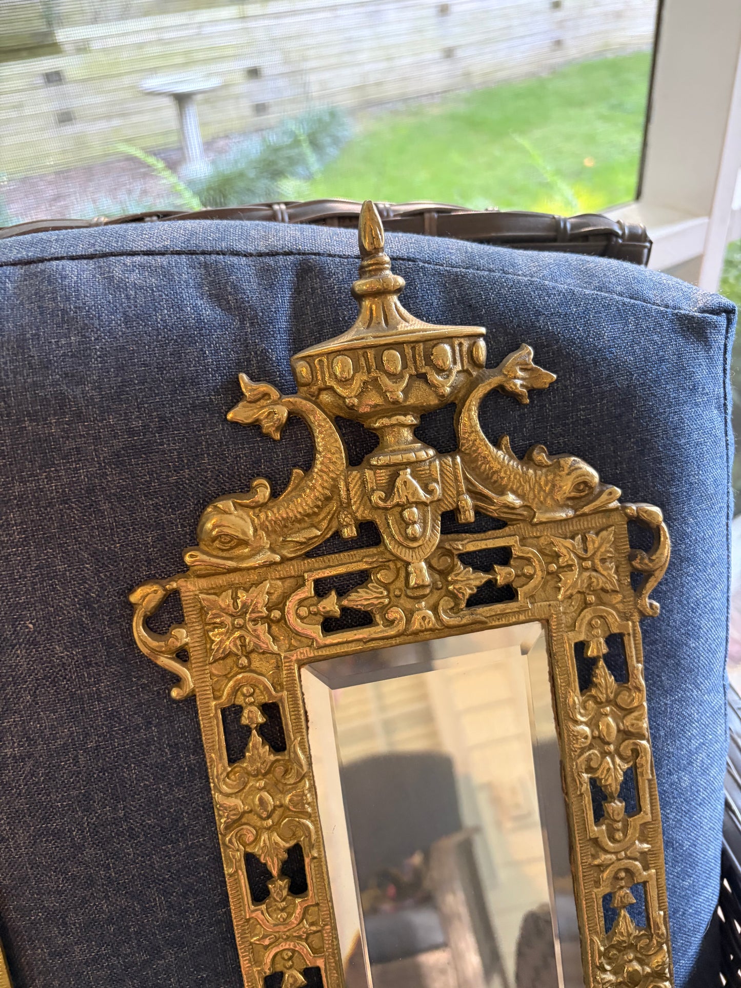 Stunning mirrored brass sconces pair with koi fish, ornate details, and tassel design!