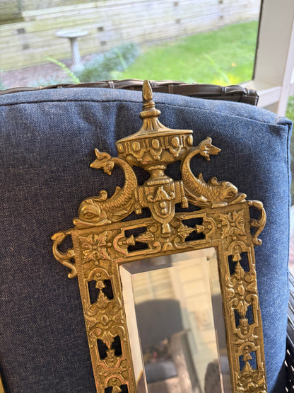 Stunning mirrored brass sconces pair with koi fish, ornate details, and tassel design!
