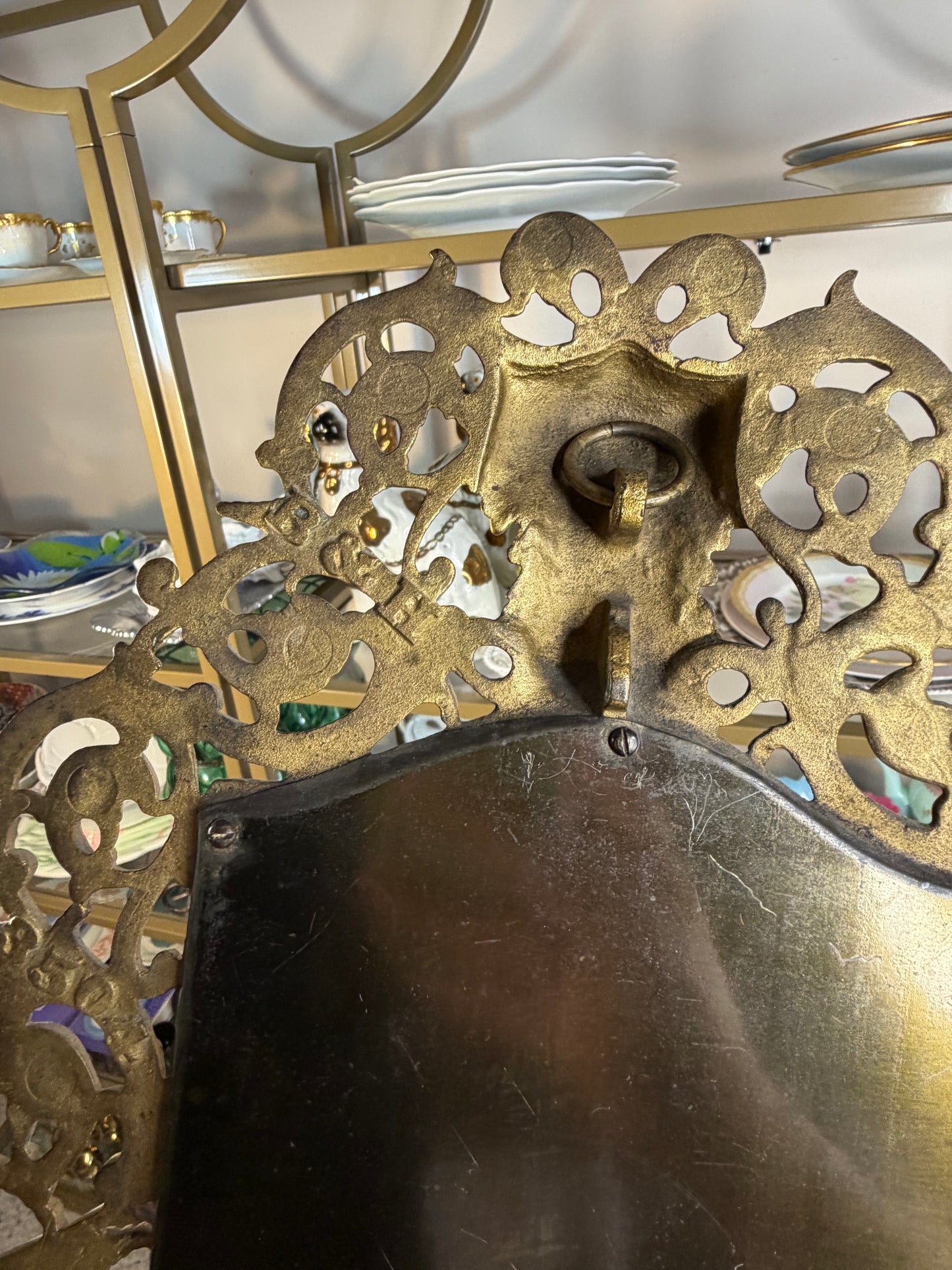 Stunning Bradley & Hubbard antique brass beveled wall mirror featuring a Bacchus figural motif and attached candle sconces!