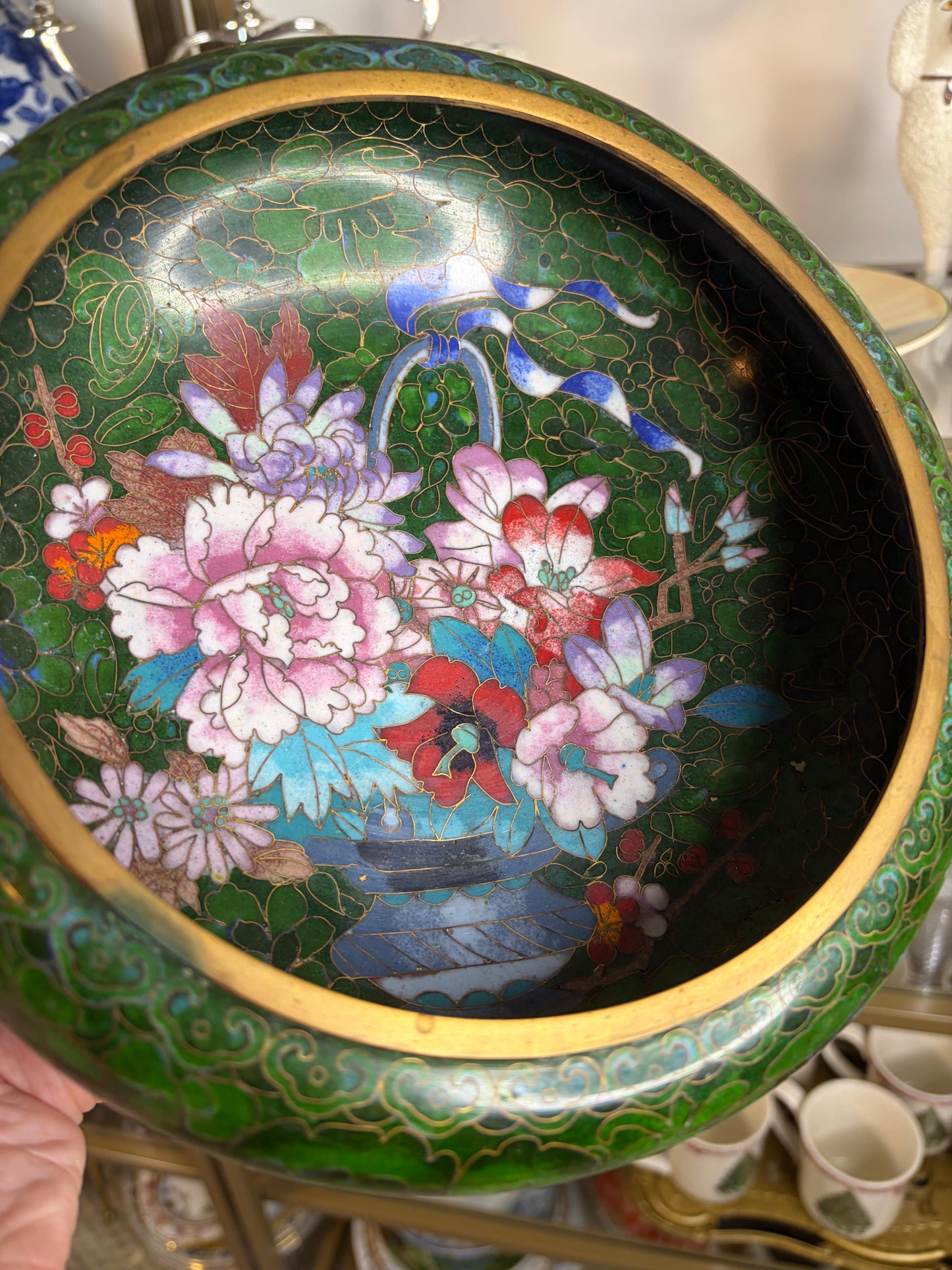 Gorgeous cloisonné green bowl featuring a bouquet and brass rim!