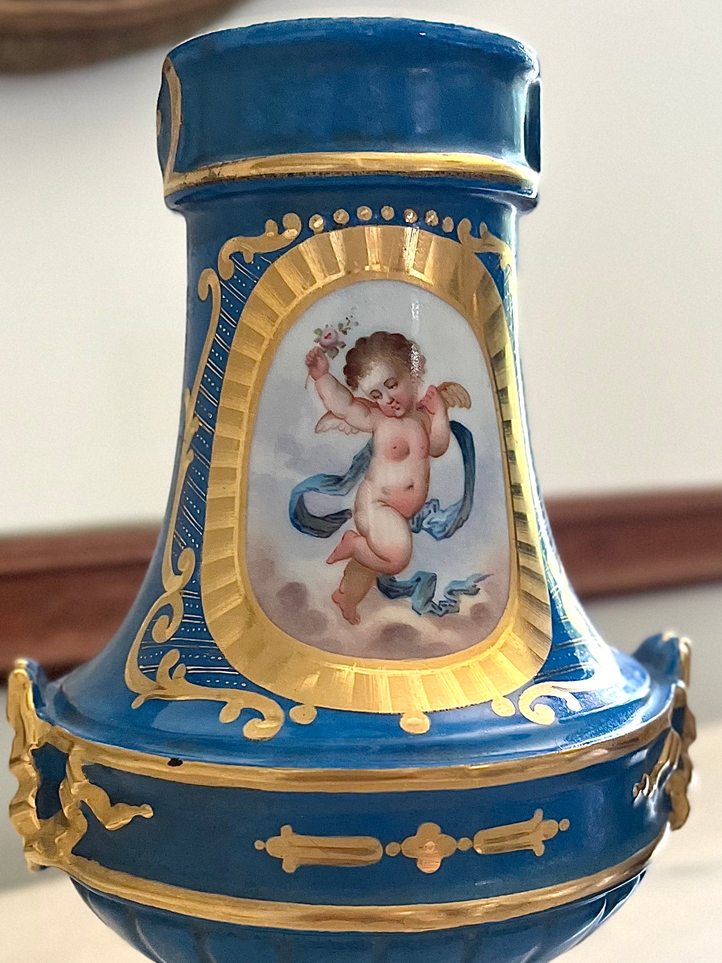 Elegant Pair of Antique 19th Century French Sèvres Style Porcelain Vases In Céleste Bleu With Hand-Painted Putti And Florals