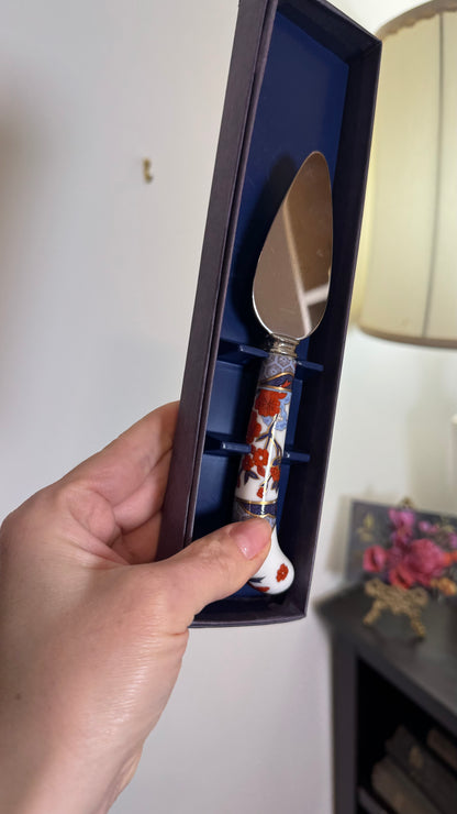 Reserved cheese cutter with porcelain handle