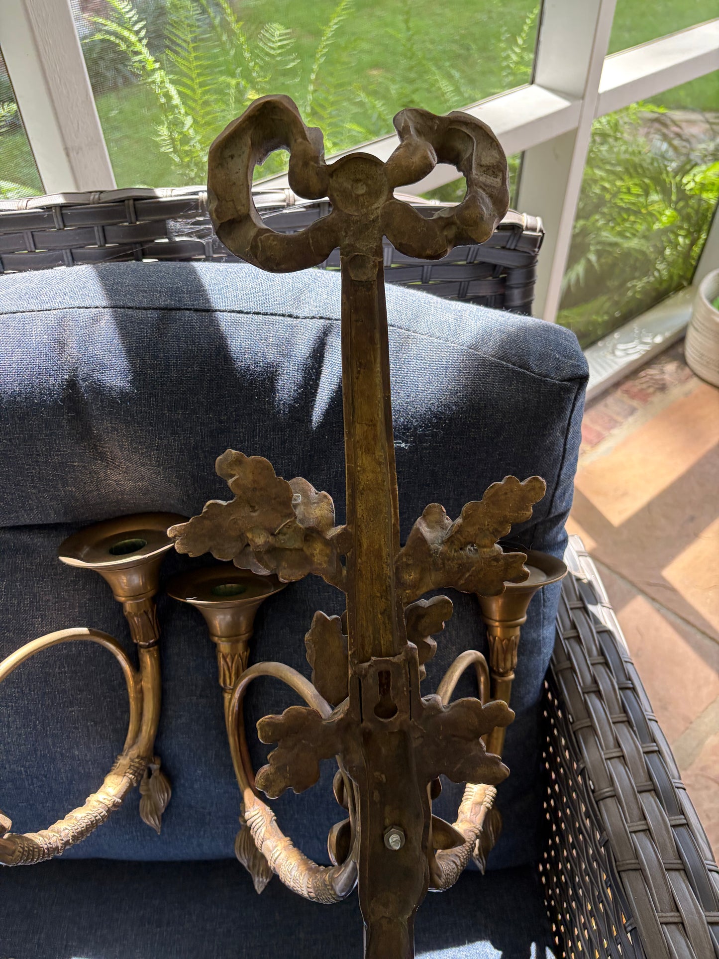 Stunning antique pair of French Louis XVI style brass wall sconces with bows, tassels, and horn motif designs!