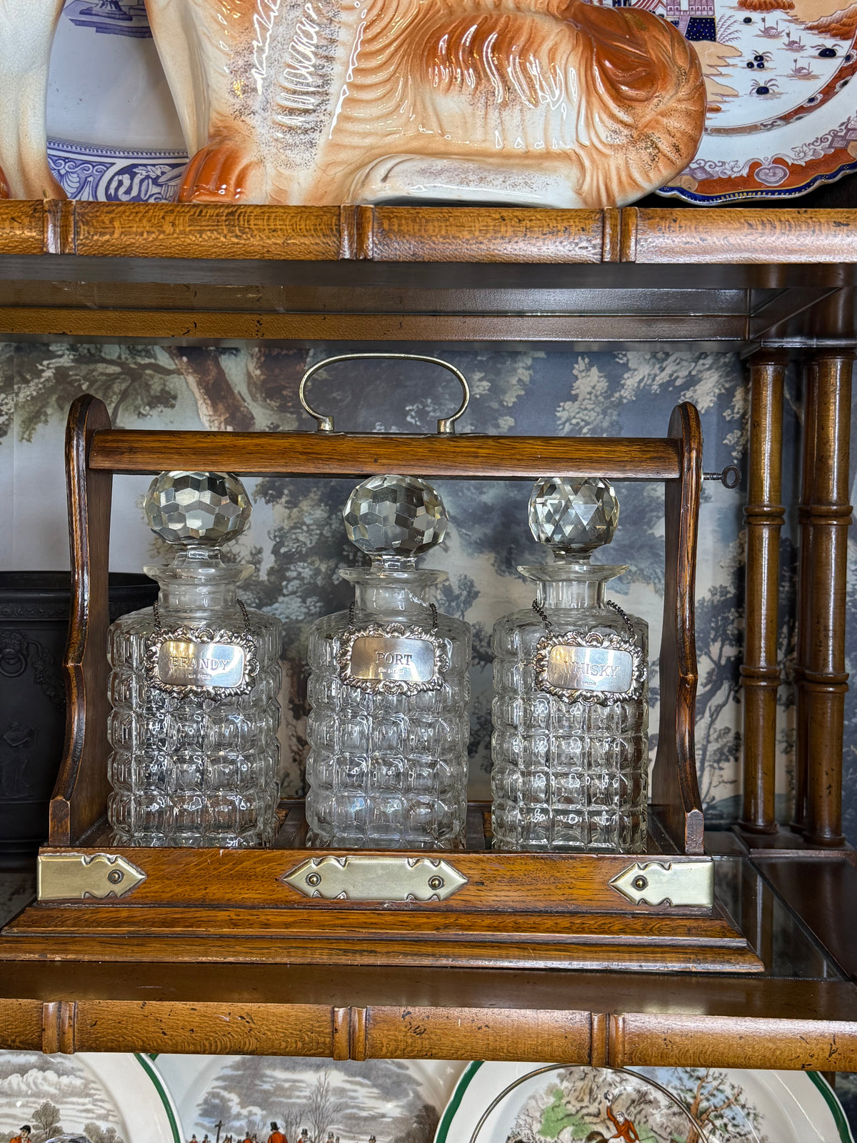 Antique English Oak Three-Bottle Tantalus W/ Cut Crystal Decanters, Sterling Silver Labels & Original Key, c.1900, 15” W x 13” H x 6.5” D