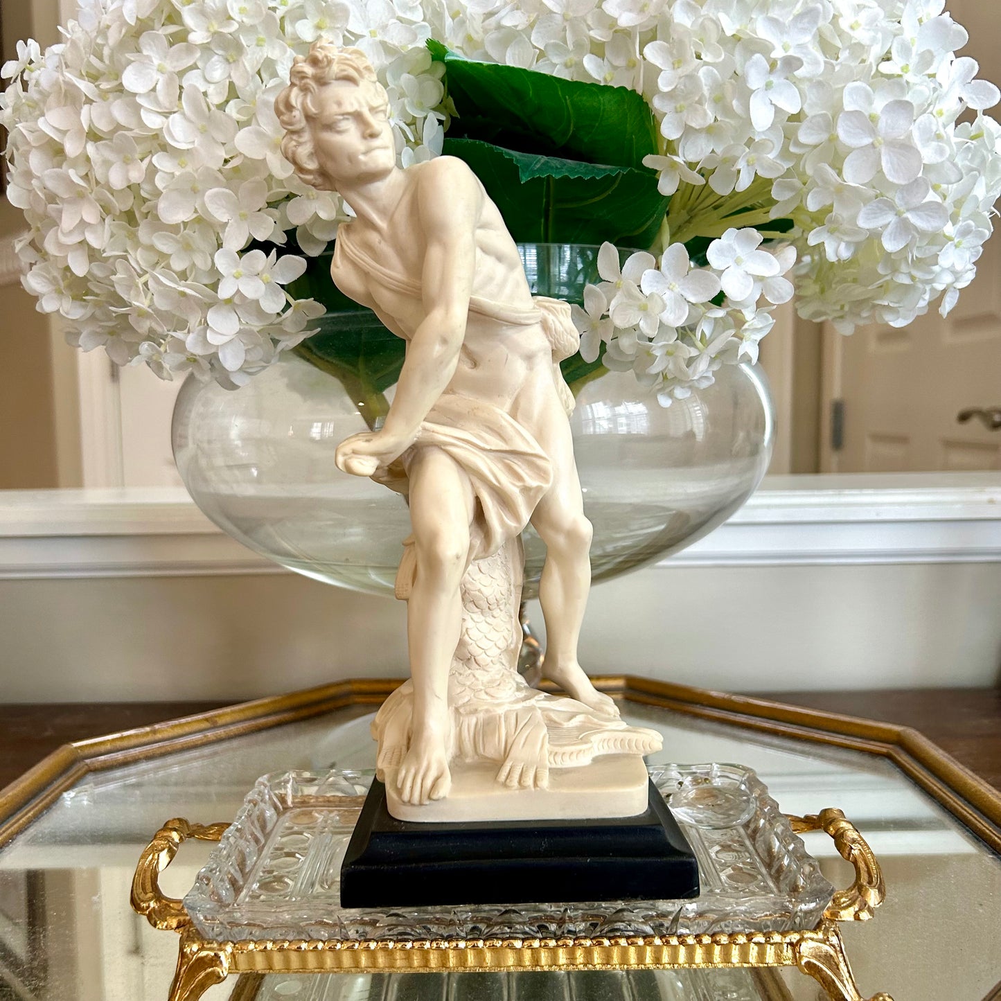 Neoclassical inspired masculine hunter vintage statue in pedestal.