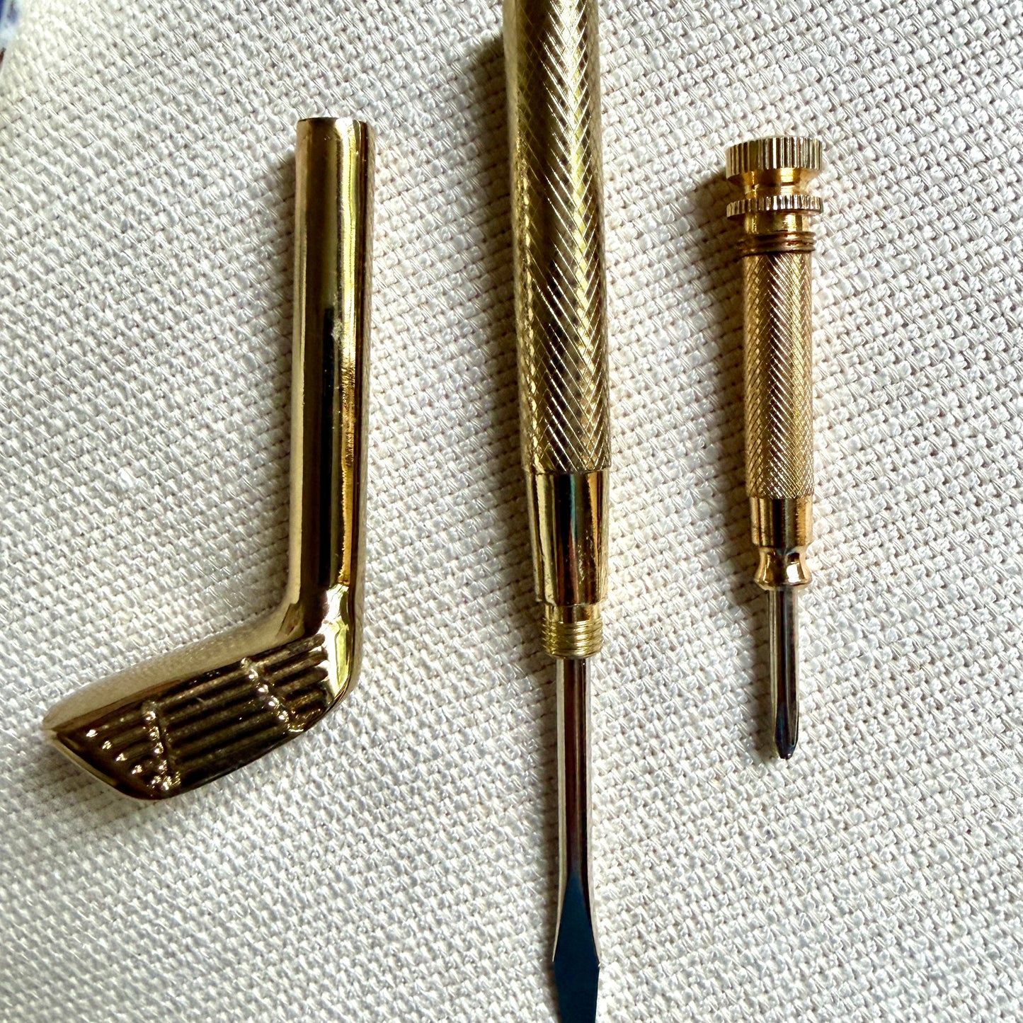 Handsome brass golf club screwdriver set.