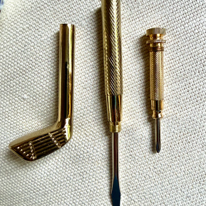 Handsome brass golf club screwdriver set.