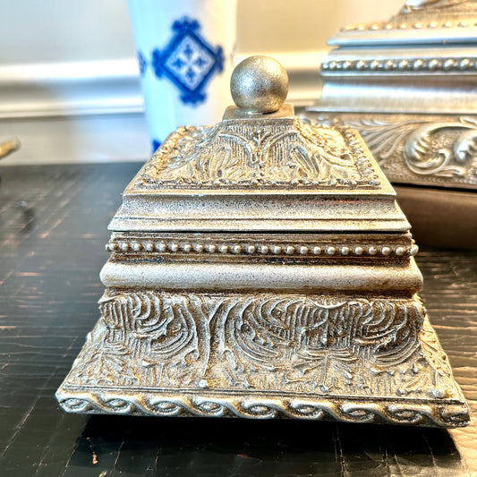 Charming silver shade baroque wooded frame box.