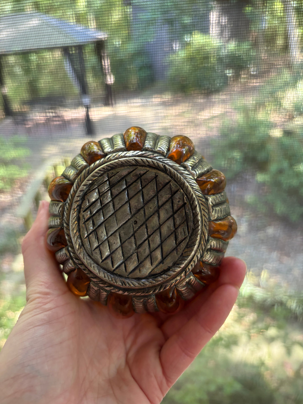 Lovely amber bubble glass vase encased in metal!