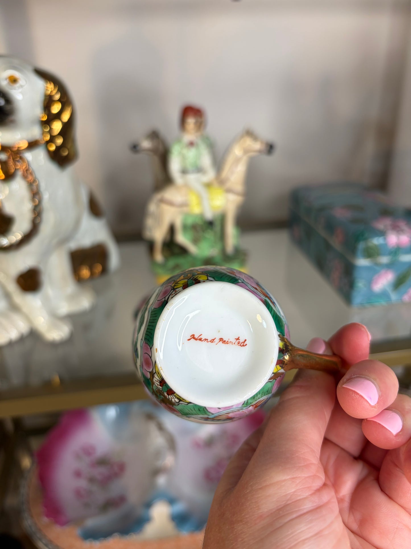 Famille Rose teacup and saucer handpainted featuring birds!