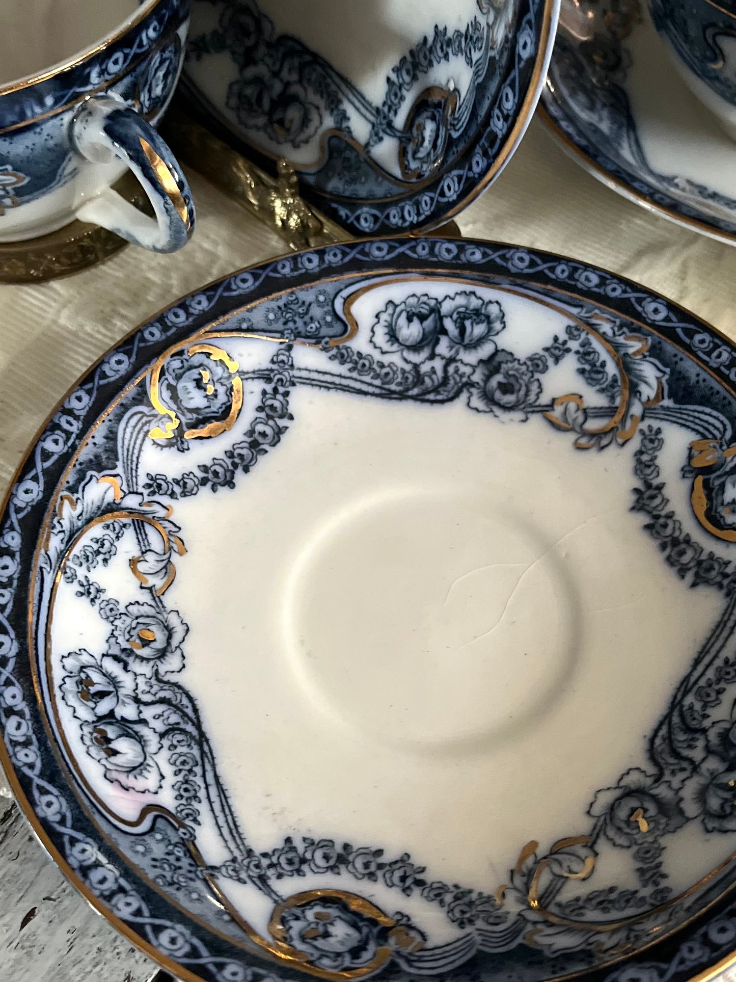 Romantic Set of 6/19th Century Royal Staffordshire “Reknown” Flow Blue Gilded Broth Cups and Saucers
