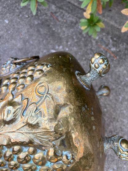 Beautiful large brass planter with grape vine motif, Lion handles, and claw feet! As is!