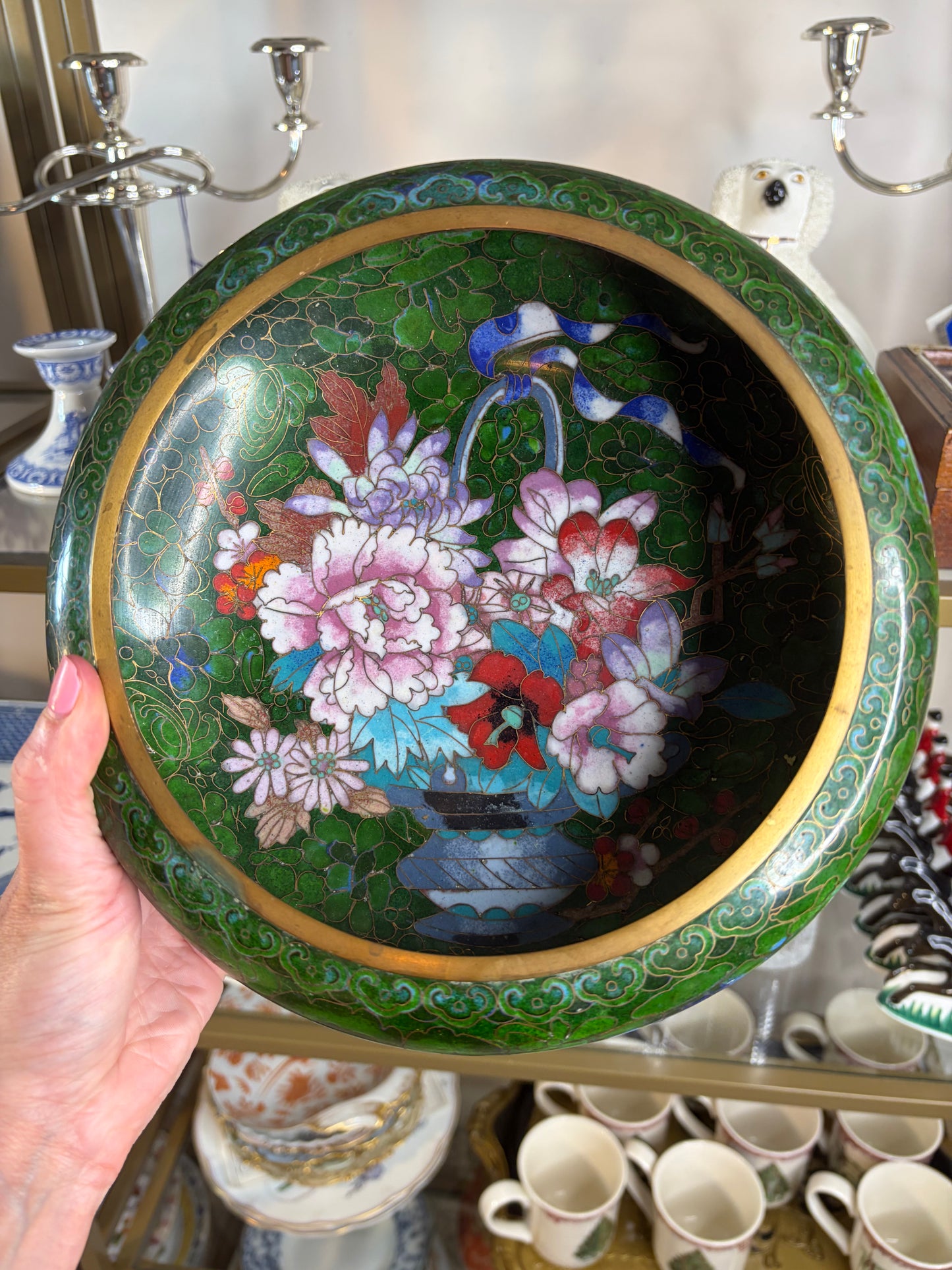Gorgeous cloisonné green bowl featuring a bouquet and brass rim!
