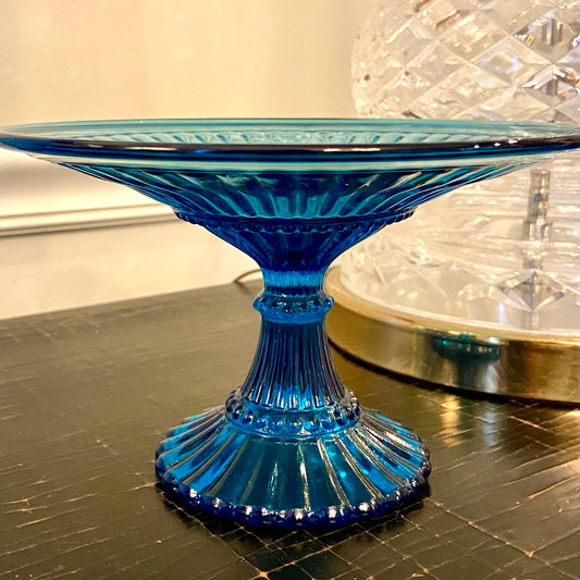 Warm blue colored glass footed candy dish on pedestal