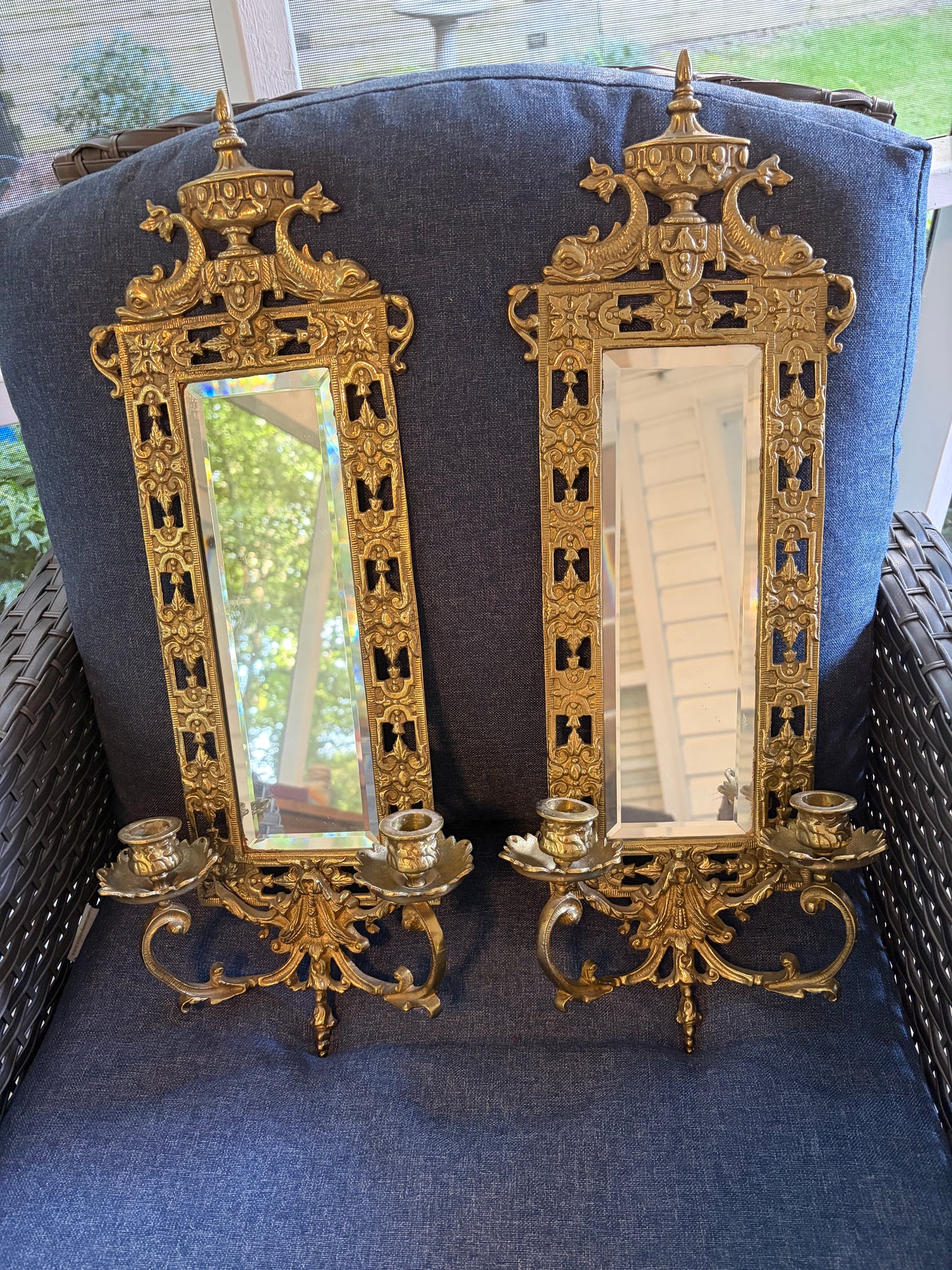 Stunning mirrored brass sconces pair with koi fish, ornate details, and tassel design!