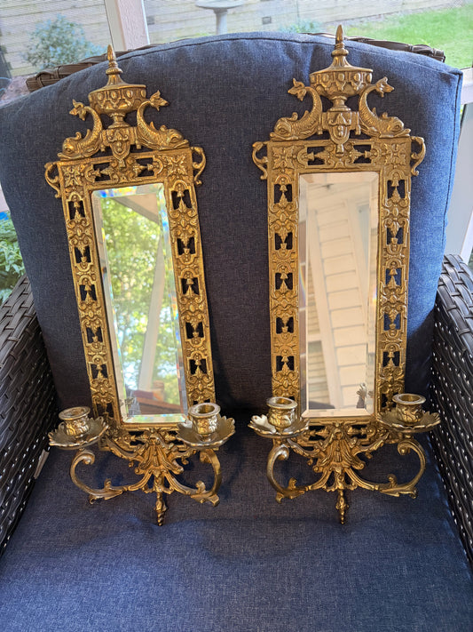 Stunning mirrored brass sconces pair with koi fish, ornate details, and tassel design!