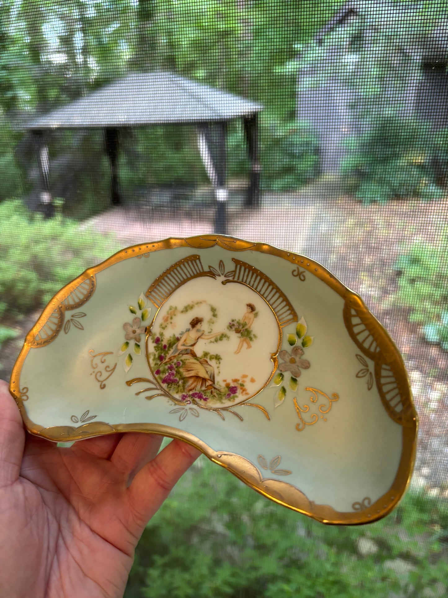 Lovely handpainted crescent dish with gold details!