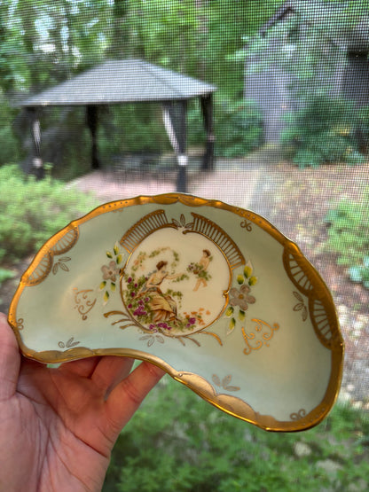 Lovely handpainted crescent dish with gold details!