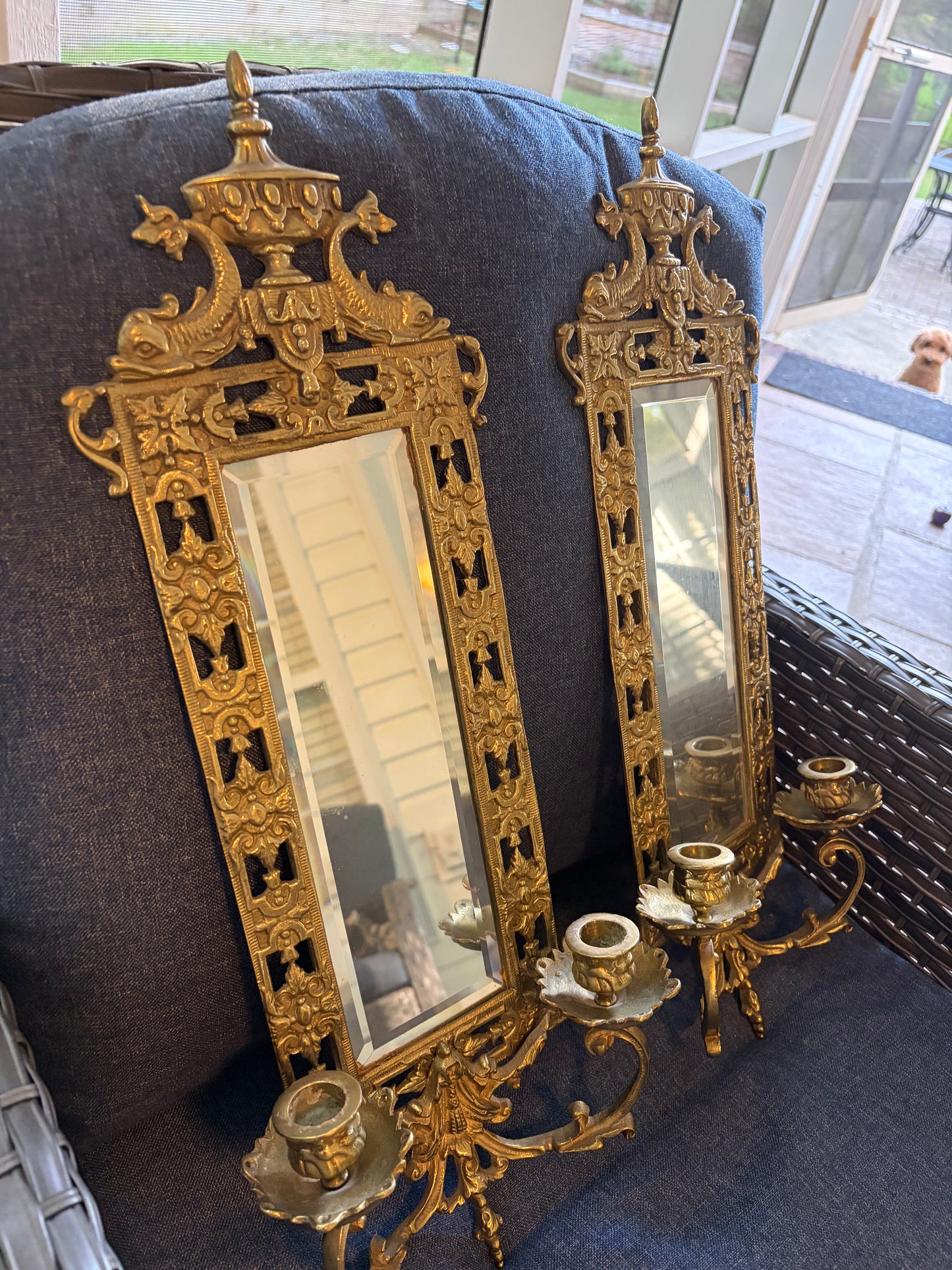 Stunning mirrored brass sconces pair with koi fish, ornate details, and tassel design!