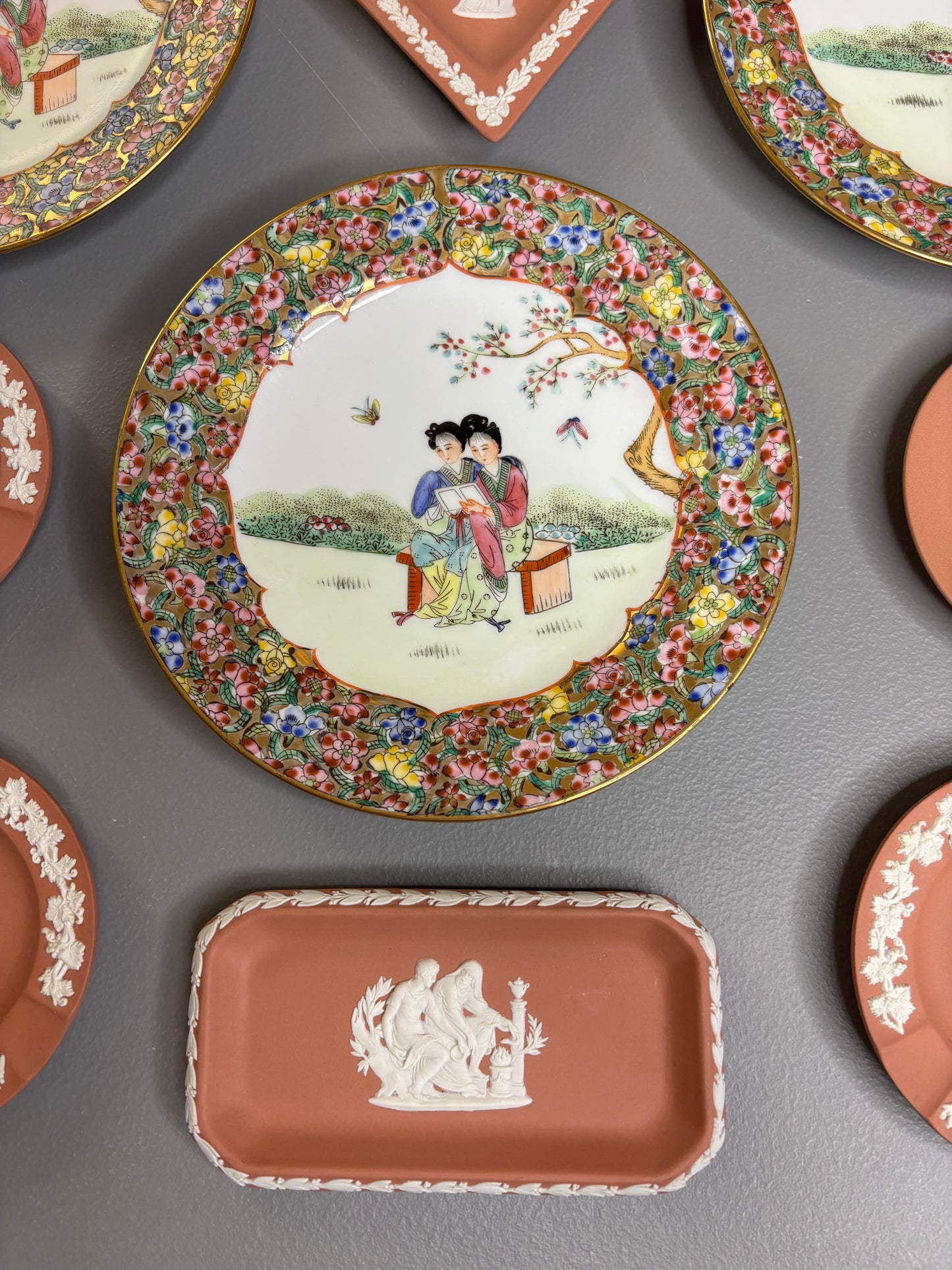 Beautiful instant plate wall! Includes 3 Famille Rose plates and 6 Wedgwood terra cotta dishes!