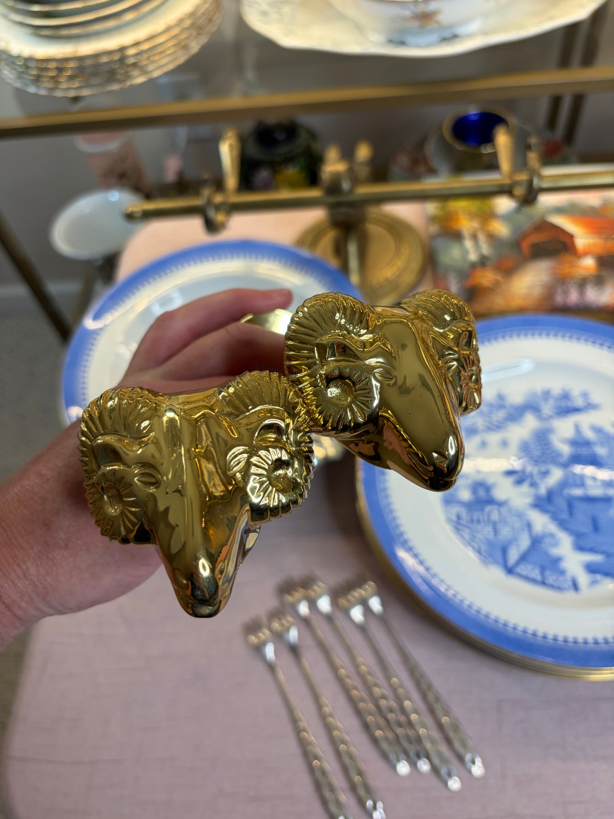 Lovely brass ram’s head brass curtain tie backs!