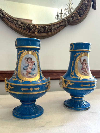 Elegant Pair of Antique 19th Century French Sèvres Style Porcelain Vases In Céleste Bleu With Hand-Painted Putti And Florals
