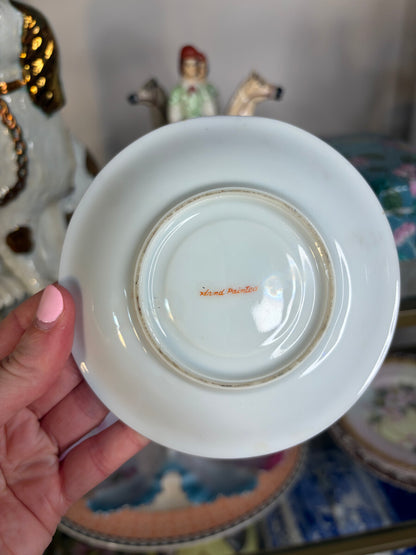 Famille Rose teacup and saucer handpainted featuring birds!