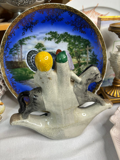 Staffordshire couple on rocking horse!