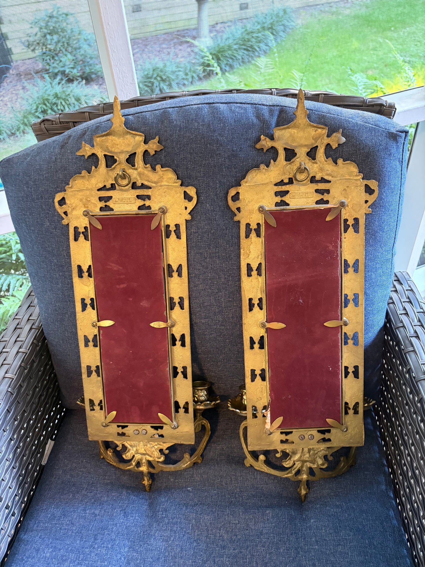 Stunning mirrored brass sconces pair with koi fish, ornate details, and tassel design!