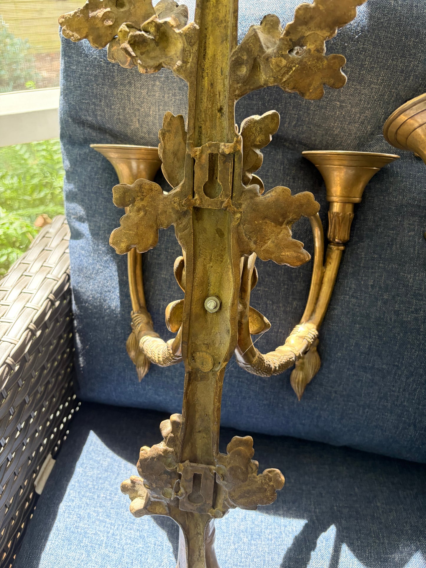Stunning antique pair of French Louis XVI style brass wall sconces with bows, tassels, and horn motif designs!