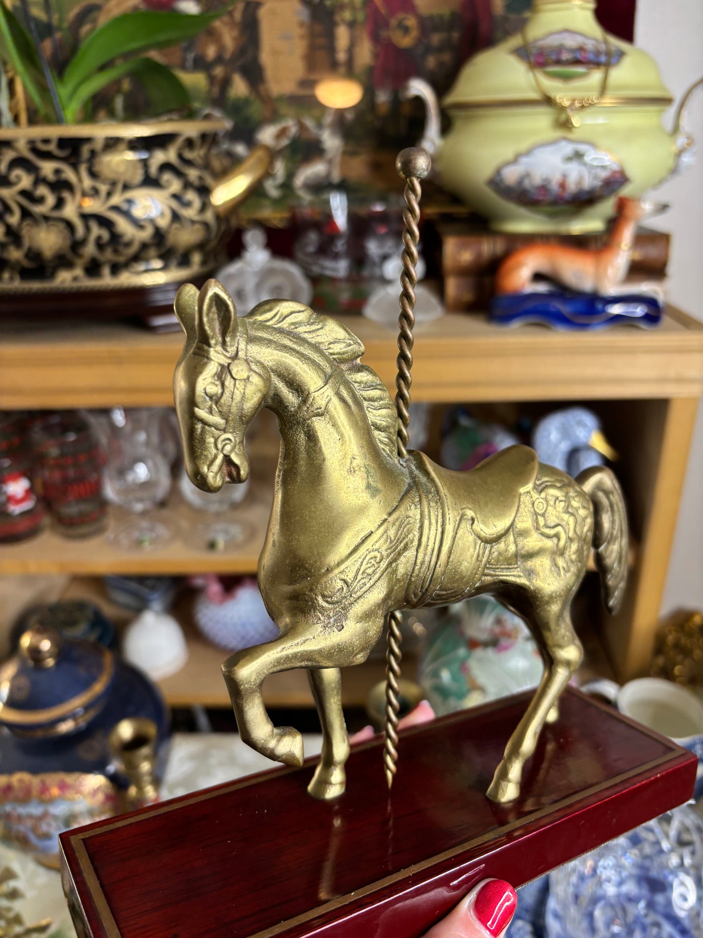 Brass carousel horse on wood!