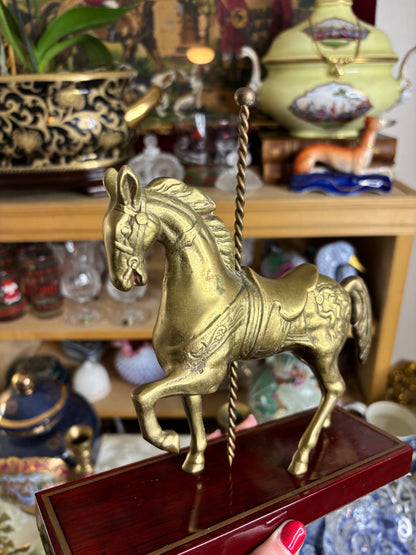 Brass carousel horse on wood!