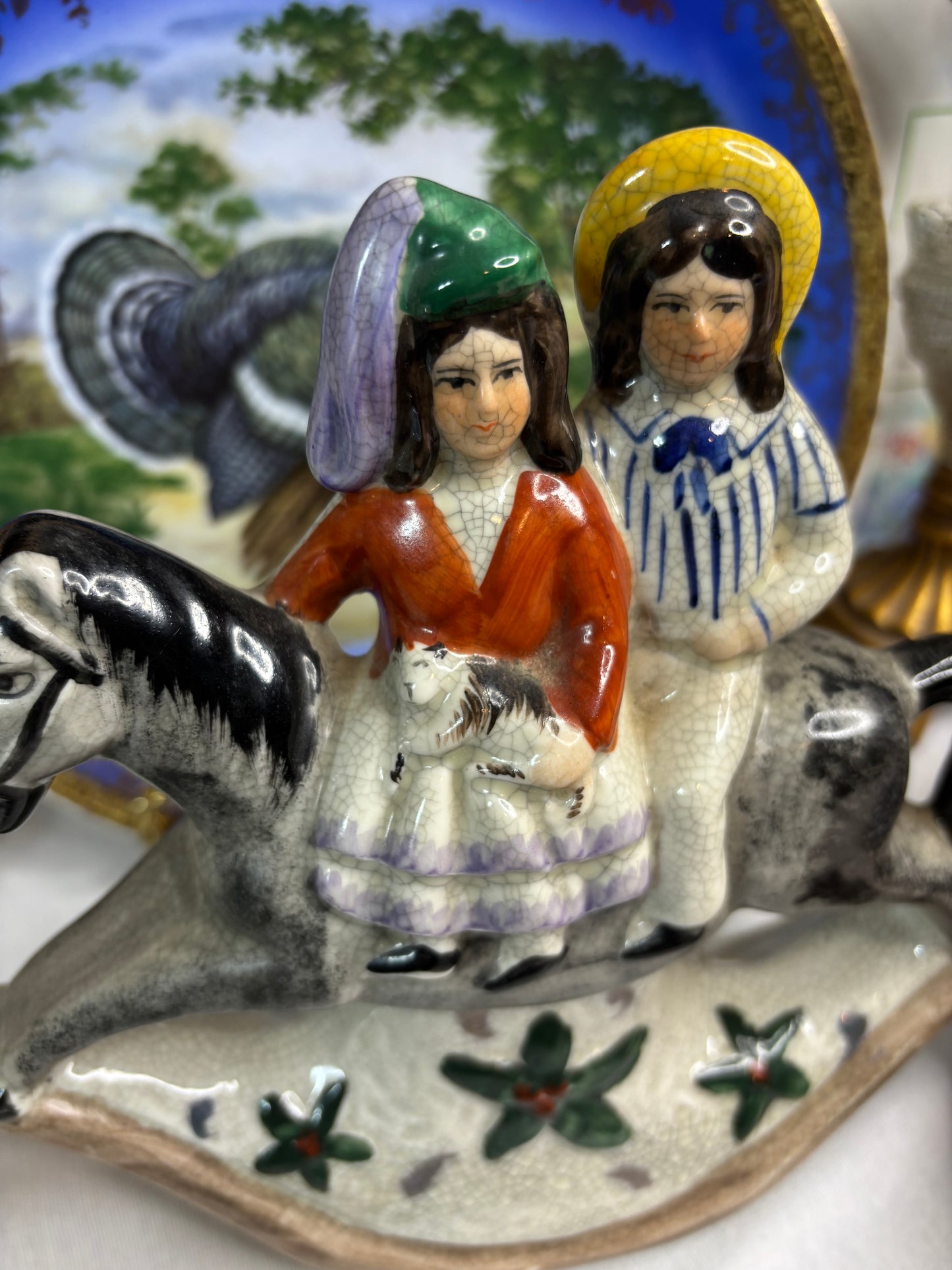 Staffordshire couple on rocking horse!