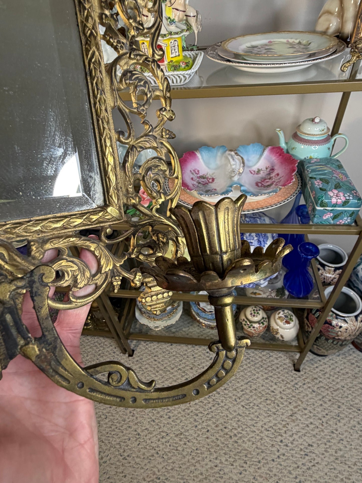 Stunning Bradley & Hubbard antique brass beveled wall mirror featuring a Bacchus figural motif and attached candle sconces!