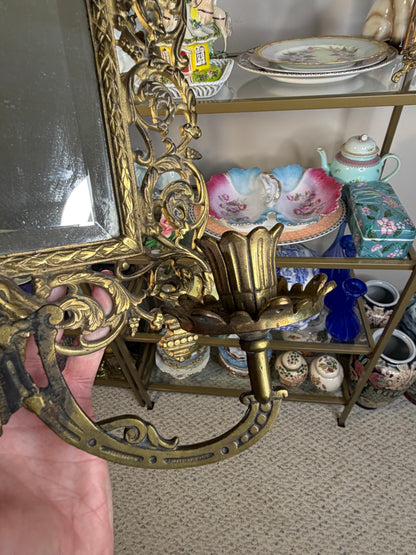 Stunning Bradley & Hubbard antique brass beveled wall mirror featuring a Bacchus figural motif and attached candle sconces!