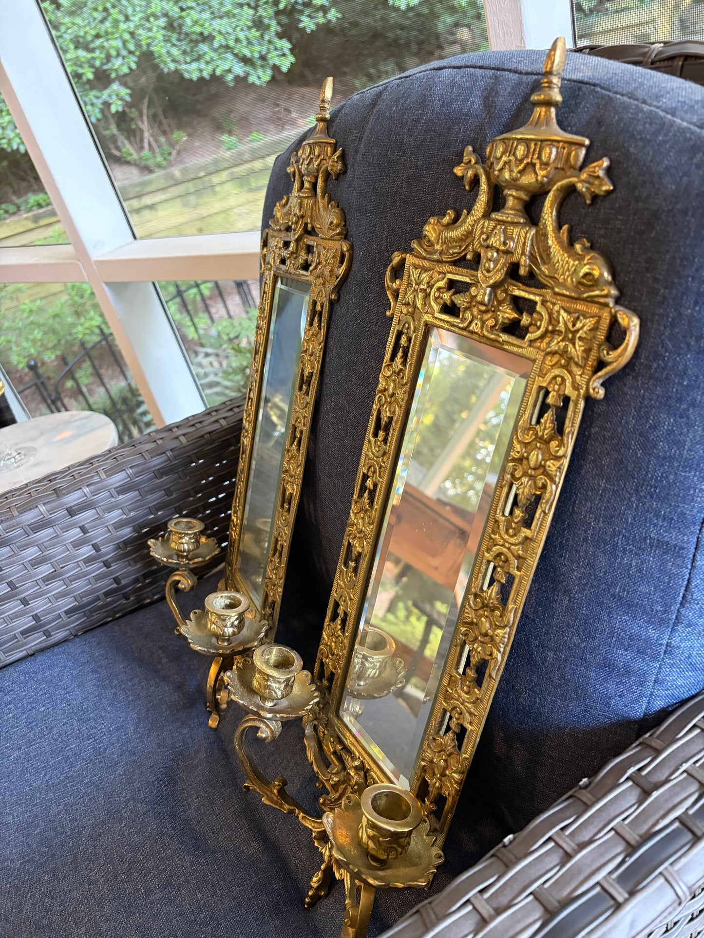 Stunning mirrored brass sconces pair with koi fish, ornate details, and tassel design!